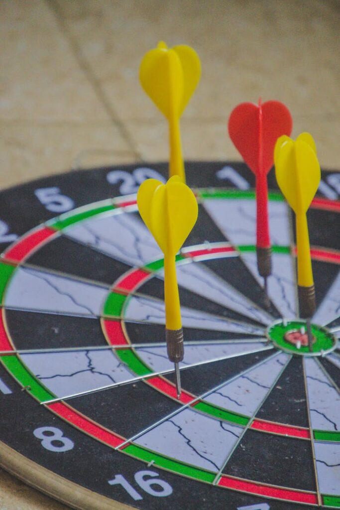 Red and Yellow Darts on a Dart Board